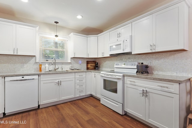7829 Alawai Ave, Diamondhead, MS 39525 - kitchen with white appliances, tasteful backsplash, white cabinets, a sink, and dark wood-style floors