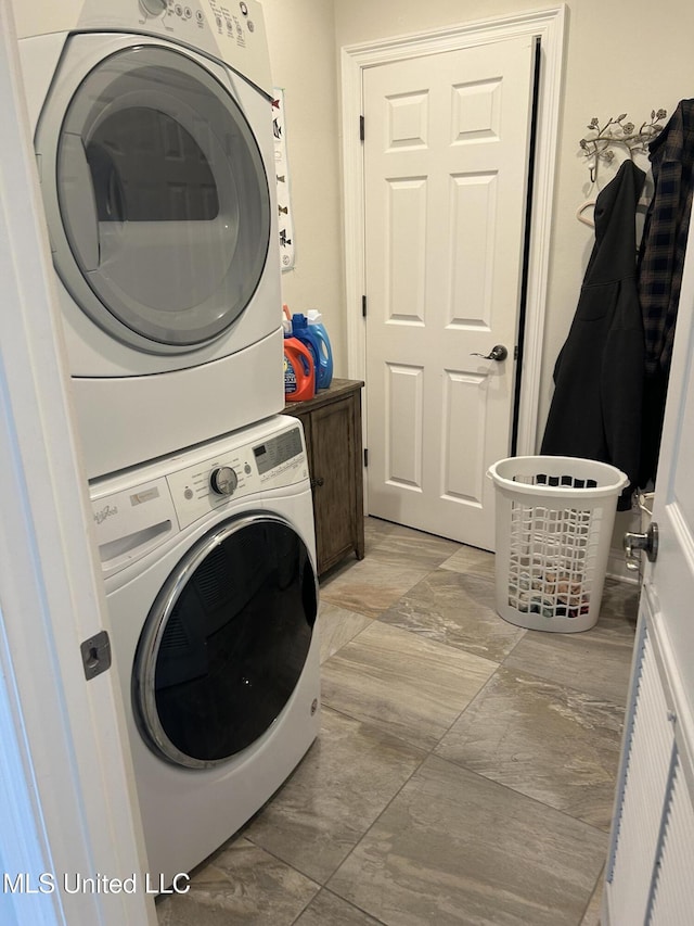 laundry area with laundry area and stacked washer and clothes dryer