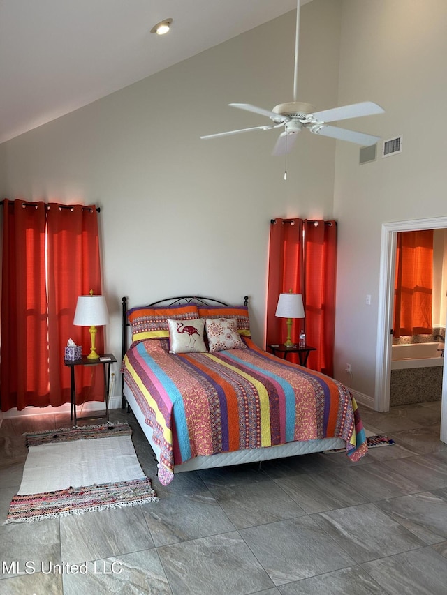 bedroom with high vaulted ceiling, visible vents, and baseboards