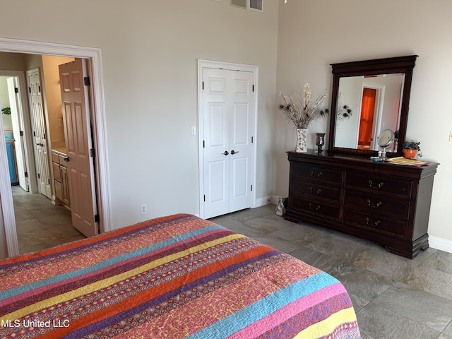 bedroom featuring baseboards