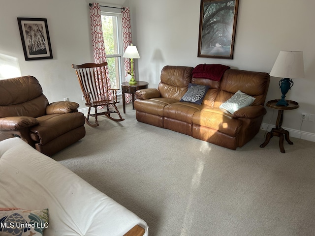 living area featuring baseboards