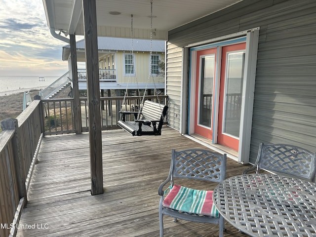 wooden terrace with a water view