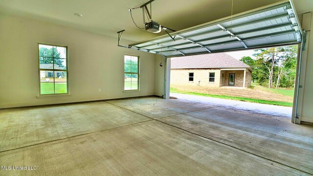 garage featuring a carport and a garage door opener