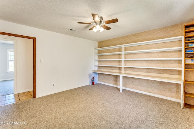 interior space featuring ceiling fan