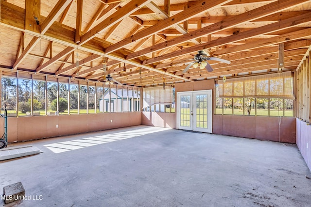 unfurnished sunroom featuring a healthy amount of sunlight and lofted ceiling