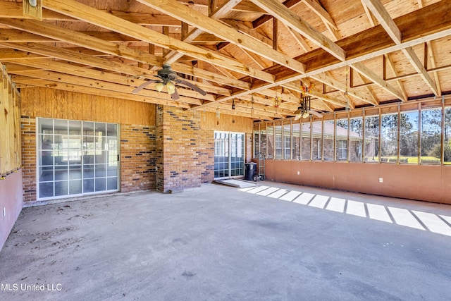 interior space featuring ceiling fan and vaulted ceiling