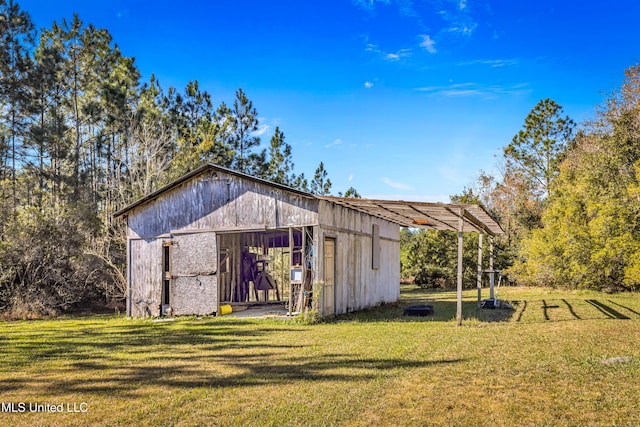 view of outbuilding with a lawn