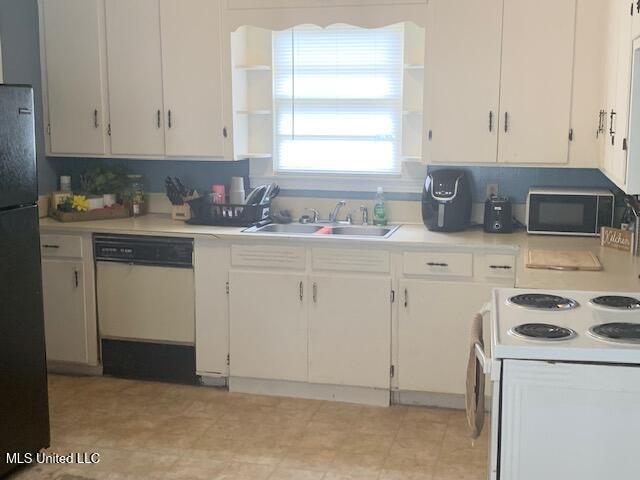 2145 Second St, Natchez, MS 39120 - kitchen with black appliances, open shelves, and light countertops