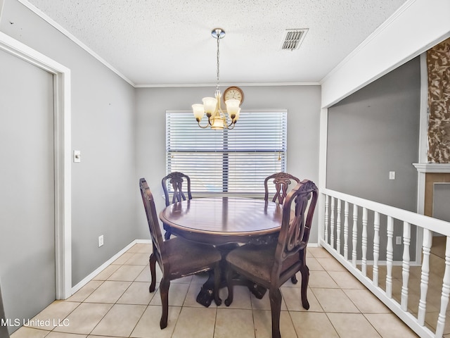 1334 Diller Rd, Ocean Springs, MS 39564 - dining area featuring a chandelier, a textured ceiling, light tile patterned floors, and ornamental molding