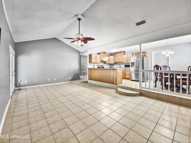 1334 Diller Rd, Ocean Springs, MS 39564 - living room with vaulted ceiling, a chandelier, ceiling fan, light tile patterned floors, and a textured ceiling
