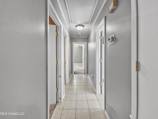 1334 Diller Rd, Ocean Springs, MS 39564 - hall with attic access, light tile patterned flooring, baseboards, and ornamental molding