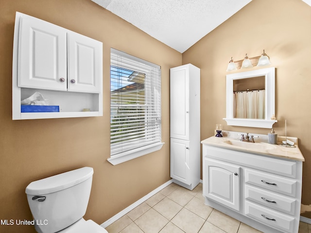 1334 Diller Rd, Ocean Springs, MS 39564 - full bathroom featuring vanity, baseboards, toilet, tile patterned floors, and a textured ceiling