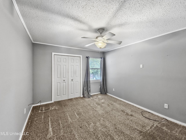 1334 Diller Rd, Ocean Springs, MS 39564 - unfurnished bedroom featuring carpet floors, a textured ceiling, a closet, crown molding, and ceiling fan