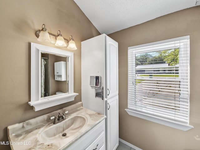 1334 Diller Rd, Ocean Springs, MS 39564 - full bathroom featuring vanity and lofted ceiling