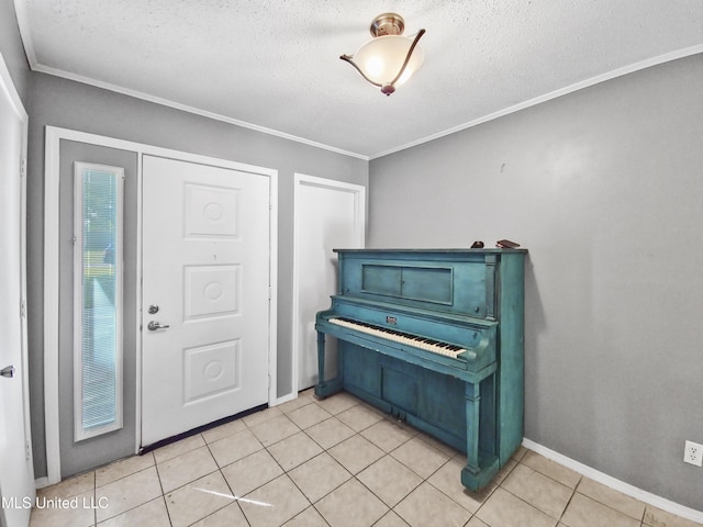 1334 Diller Rd, Ocean Springs, MS 39564 - entrance foyer featuring a textured ceiling, crown molding, light tile patterned floors, and baseboards