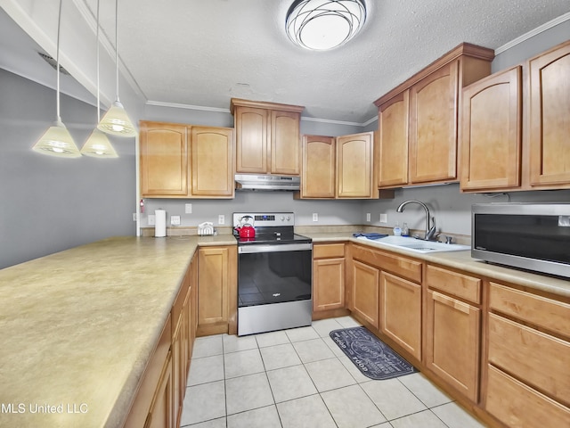 1334 Diller Rd, Ocean Springs, MS 39564 - kitchen with stainless steel appliances, under cabinet range hood, a sink, light countertops, and light tile patterned flooring