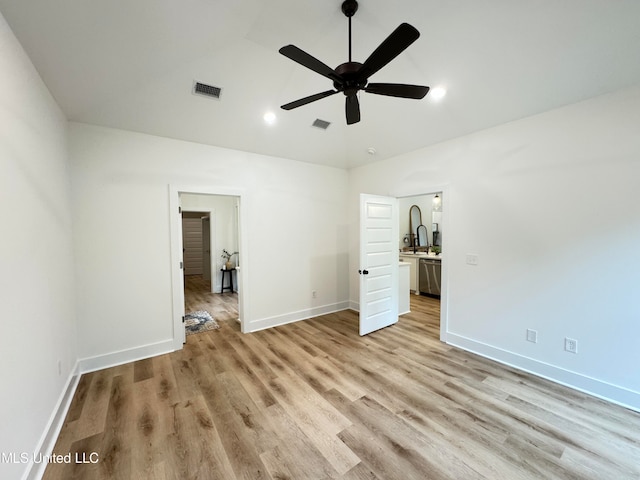 unfurnished bedroom with light wood-type flooring and ceiling fan