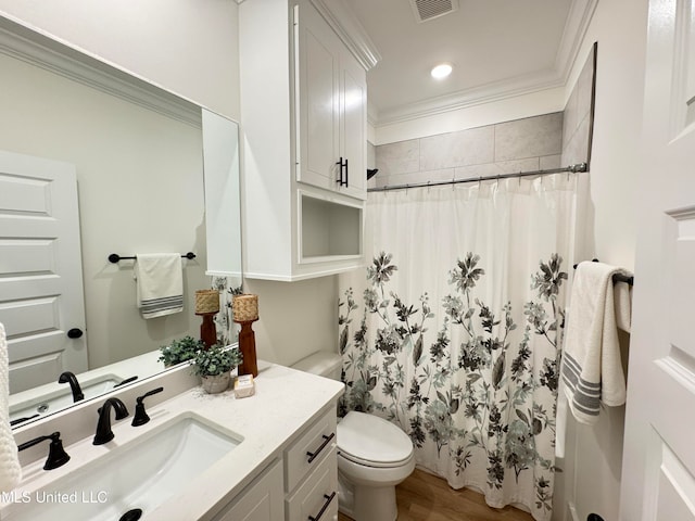 bathroom with hardwood / wood-style flooring, toilet, crown molding, curtained shower, and vanity