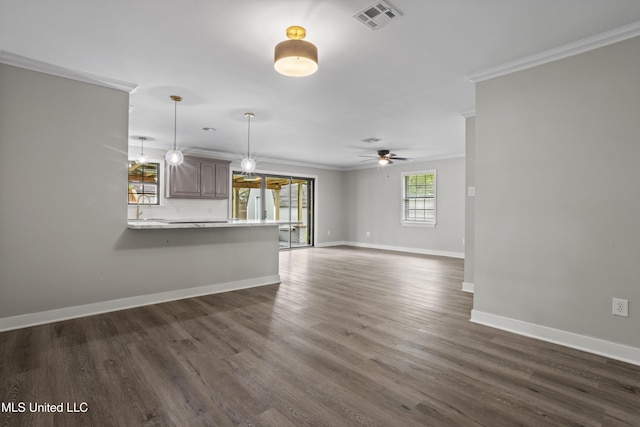 unfurnished living room featuring crown molding, ceiling fan, baseboards, dark wood-style flooring, and a sink