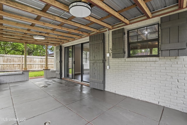 view of patio / terrace featuring fence