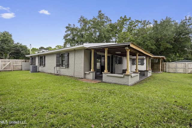 back of property with central AC, a patio, an outdoor hangout area, and brick siding