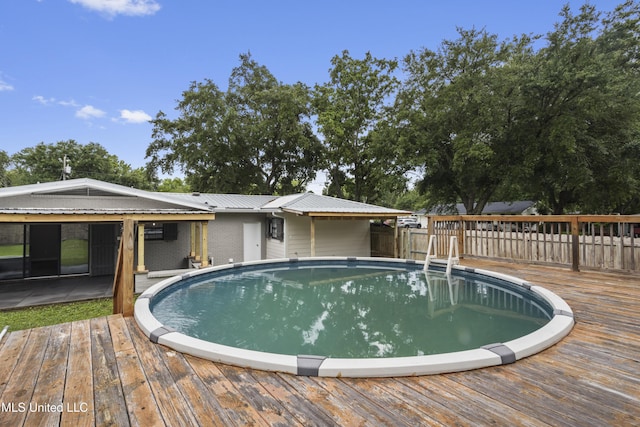 outdoor pool featuring a wooden deck