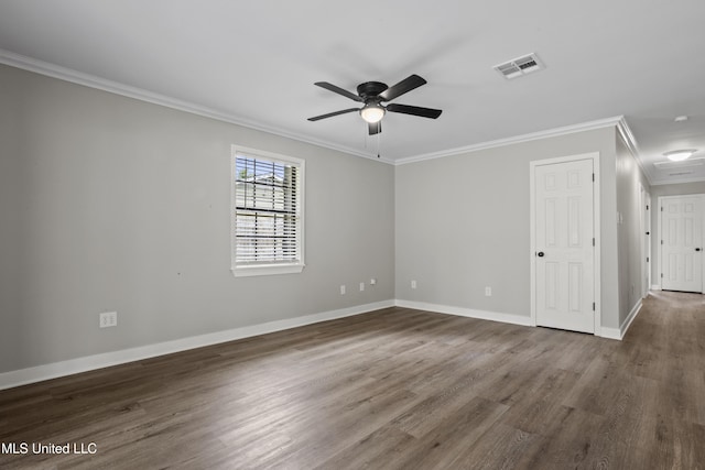 unfurnished room with ornamental molding, ceiling fan, dark wood-type flooring, and baseboards