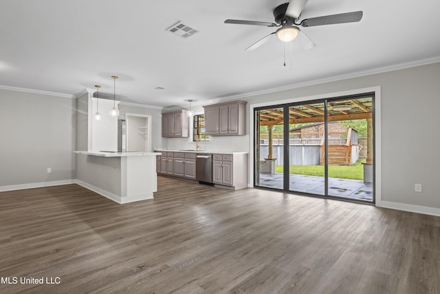 unfurnished living room featuring ornamental molding, baseboards, dark wood finished floors, a ceiling fan, and a sink