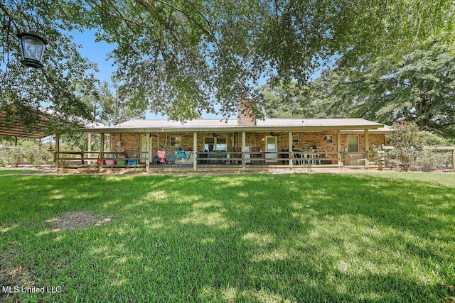 9414 Hillsboro Ludlow Rd, Lena, MS 39094 - back of property with a chimney, a yard, and a patio area
