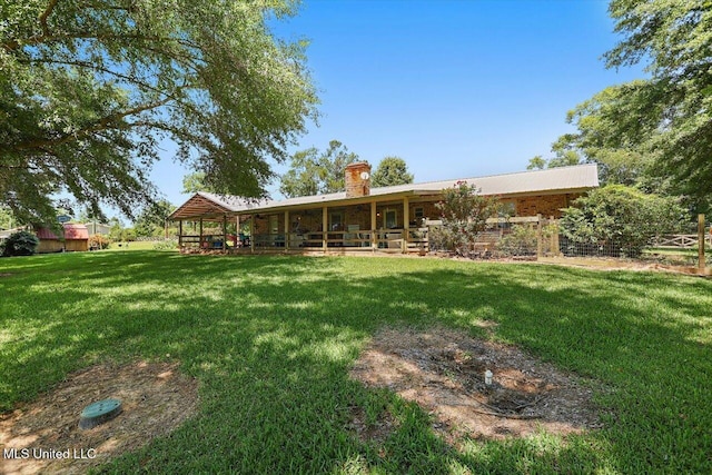 9414 Hillsboro Ludlow Rd, Lena, MS 39094 - rear view of property with a lawn and a chimney