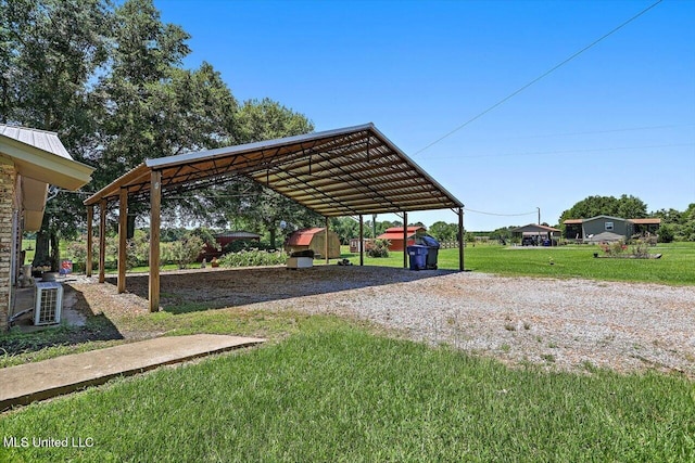 9414 Hillsboro Ludlow Rd, Lena, MS 39094 - view of parking with driveway and a carport