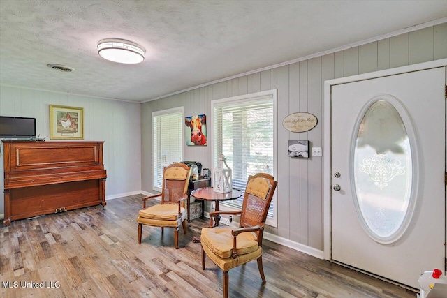9414 Hillsboro Ludlow Rd, Lena, MS 39094 - living area with ornamental molding, baseboards, wood finished floors, and a textured ceiling
