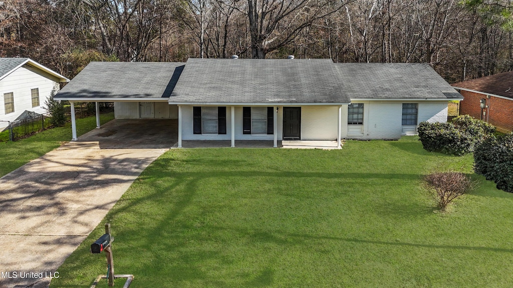 ranch-style home with covered porch, a front lawn, and a carport