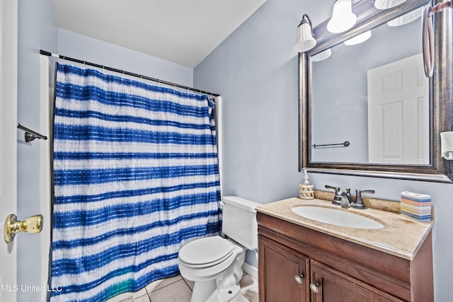 bathroom with curtained shower, tile patterned floors, vanity, and toilet