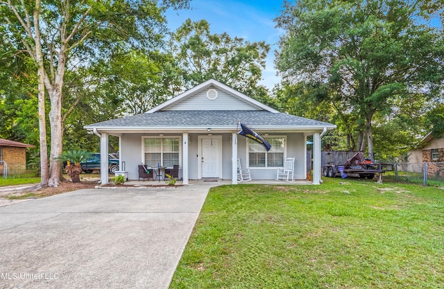 15608 Anderson Dr, Biloxi, MS 39532 - bungalow-style house with a porch, stucco siding, a shingled roof, and driveway