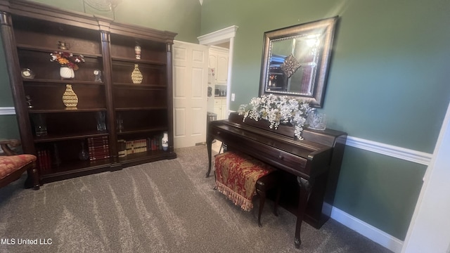 living area featuring carpet