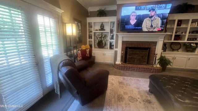 living room featuring ornamental molding, a fireplace, built in features, and wood finished floors