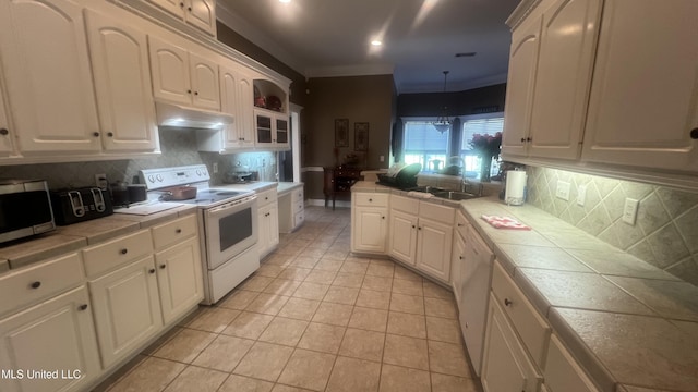 kitchen featuring white appliances, tile countertops, under cabinet range hood, white cabinetry, and decorative backsplash
