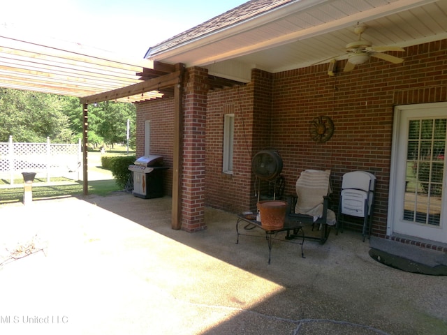 view of patio / terrace featuring ceiling fan, area for grilling, and fence