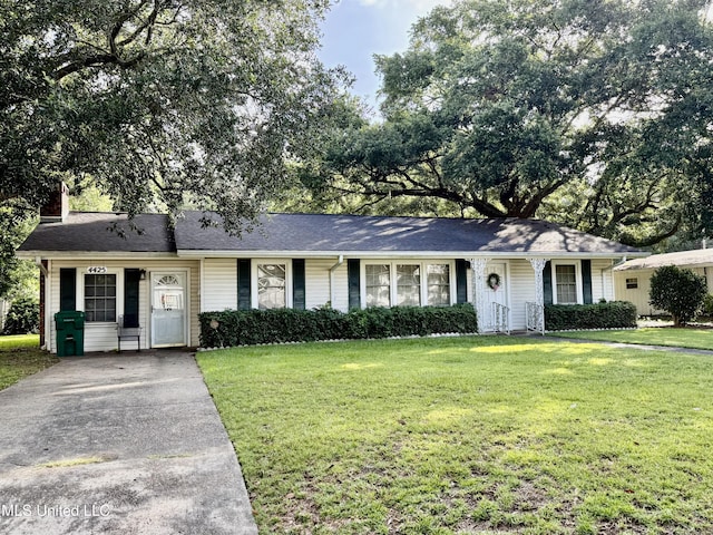 4425 Oak Ave, Moss Point, MS 39563 - ranch-style house featuring a front yard, concrete driveway, and a chimney
