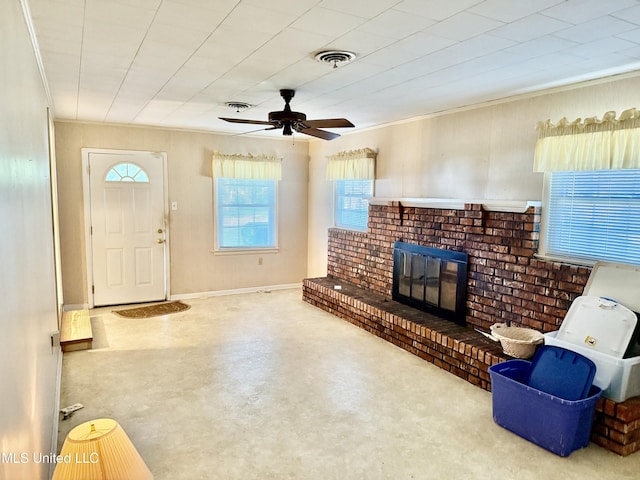 4425 Oak Ave, Moss Point, MS 39563 - unfurnished living room featuring a brick fireplace, a ceiling fan, and crown molding