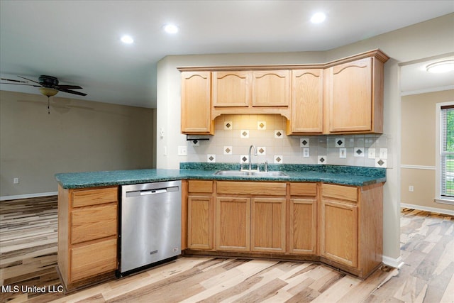 9015 Champlain Dr, Olive Branch, MS 38654 - kitchen with stainless steel dishwasher, a sink, light wood finished floors, decorative backsplash, and recessed lighting