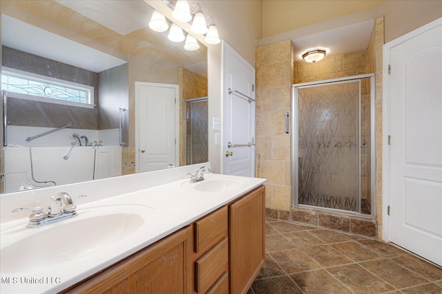 9015 Champlain Dr, Olive Branch, MS 38654 - bathroom featuring a shower stall and double vanity
