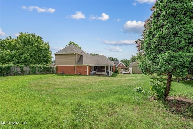 9015 Champlain Dr, Olive Branch, MS 38654 - view of yard featuring a sunroom and central AC
