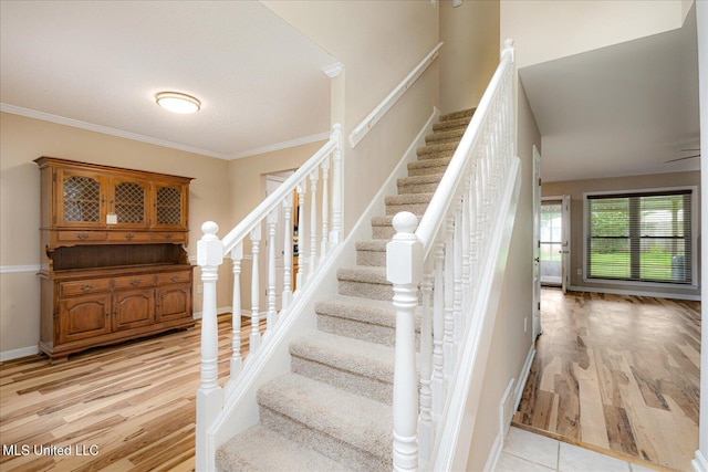 9015 Champlain Dr, Olive Branch, MS 38654 - stairs with wood finished floors, ornamental molding, and baseboards