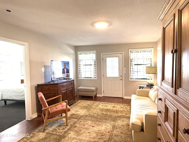 sitting room featuring wood finished floors and baseboards