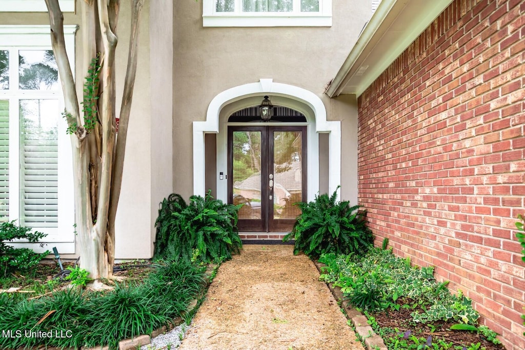 628 Kinsington Ct, Ridgeland, MS 39157 - view of exterior entry with french doors and stucco siding