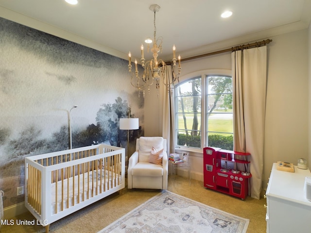 carpeted bedroom featuring a chandelier, a nursery area, and ornamental molding