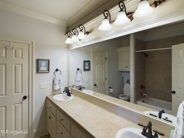 full bathroom with vanity, toilet, and tiled shower / bath