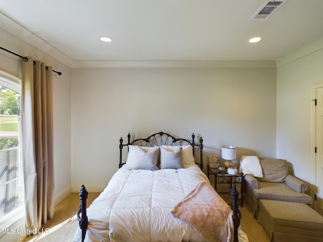 bedroom with carpet floors and ornamental molding